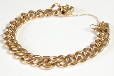 Lot 595 - A yellow metal curb-link bracelet, the clasp...