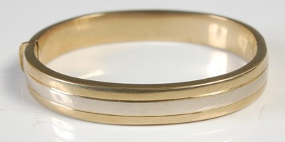 Lot 610 - A yellow and white metal hinged...