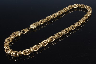 Lot 573 - A yellow metal necklace, stamped '750',...