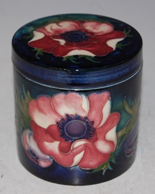 Lot 36 - A Moorcroft pottery blue ground jar and cover,...