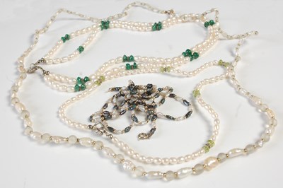 Lot 658 - A group of four assorted pearl necklaces, to...