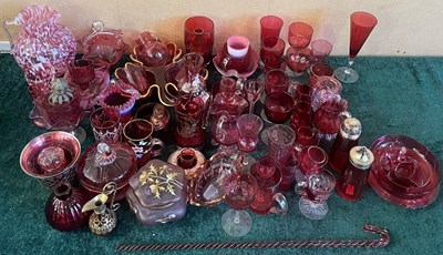 Lot 721 - A large collection of assorted cranberry glass.