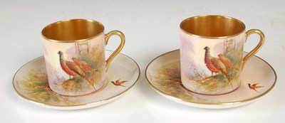 Lot 780 - A pair of Crown Devon hand-painted coffee cans...
