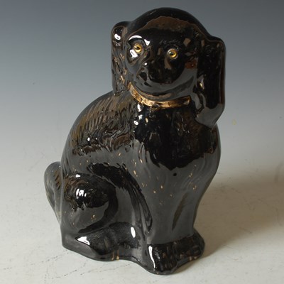 Lot 754 - A late 19th century black glazed Staffordshire...