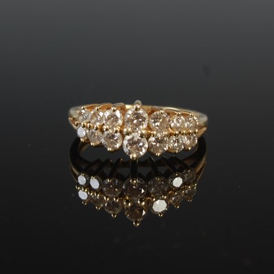 Lot 613D - A yellow metal and diamond fourteen stone...