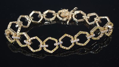 Lot 644C - A yellow metal and gem set bracelet, set with...