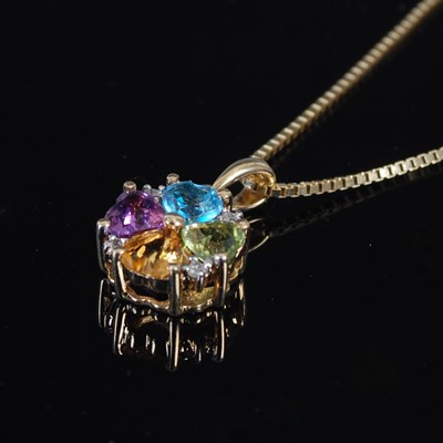 Lot 644K - A yellow metal and coloured gem set pendant...