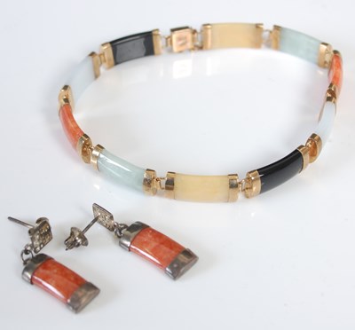 Lot 644L - A yellow metal mounted hard stone bracelet,...