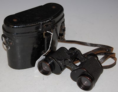 Lot 243 - A vintage metal cased set of binoculars by...