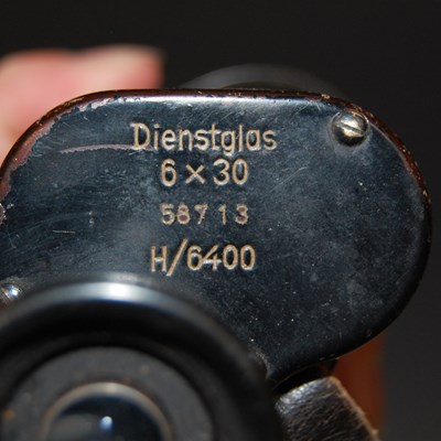 Lot 243 - A vintage metal cased set of binoculars by...