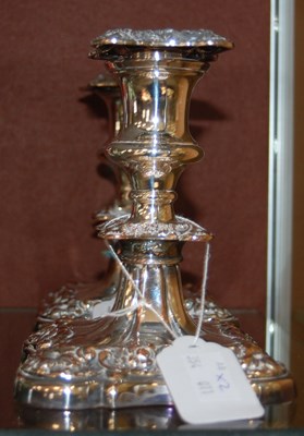 Lot 7 - A pair of Sheffield plate candlesticks with...