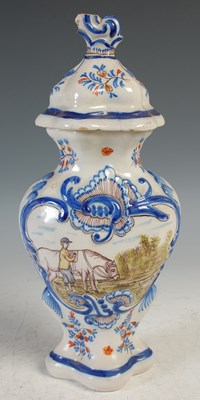 Lot 28 - A Delft pottery jar and cover, decorated with...