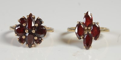 Lot 49 - Two 9ct gold and garnet set dress rings, one...