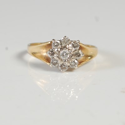 Lot 51 - An 18ct gold and diamond cluster ring, size N,...