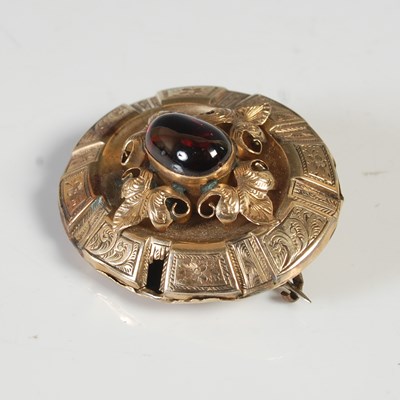 Lot 59 - A Victorian yellow metal oval brooch, centred...