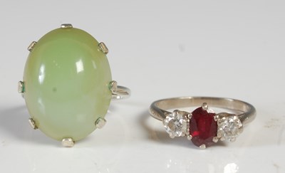 Lot 64 - A white metal three stone gem set dress ring,...