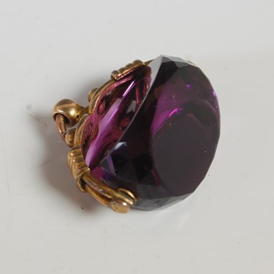 Lot 65 - A 9ct gold mounted purple gem stone spinner...