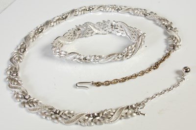 Lot 101 - Trifari, a white metal bracelet and matching...