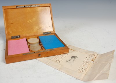 Lot 141 - An antique Treen playing card box, containing...
