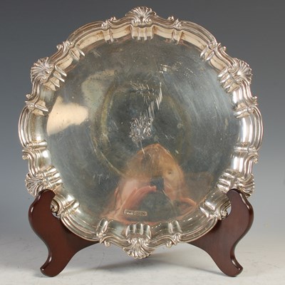 Lot 148 - A Sheffield silver salver, raised on three...