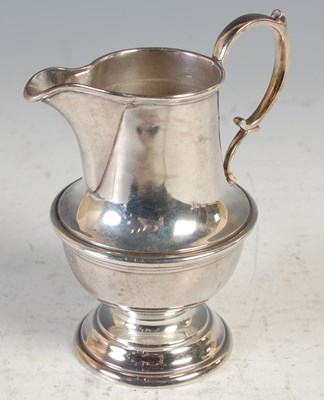 Lot 160 - A Scottish silver cream jug, Edinburgh 1928,...