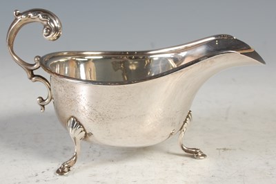 Lot 162 - A Birmingham silver sauce boat, raised on...