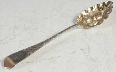 Lot 170 - A George III silver berry spoon, London 1804,...