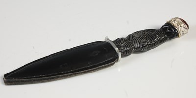 Lot 179 - A white metal mounted childs sgian dubh, the...