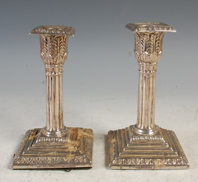Lot 182 - A pair of Sheffield silver candlesticks with...