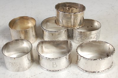 Lot 203 - A collection of seven assorted silver napkin...
