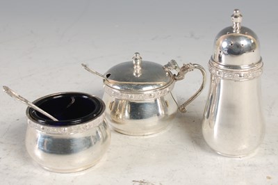 Lot 209 - A silver three piece cruet set.