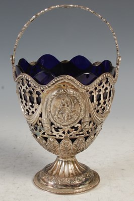 Lot 219 - A George III silver basket, London 1775,...