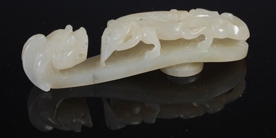 Lot 238 - A Chinese jade belt hook, carved and pierced...