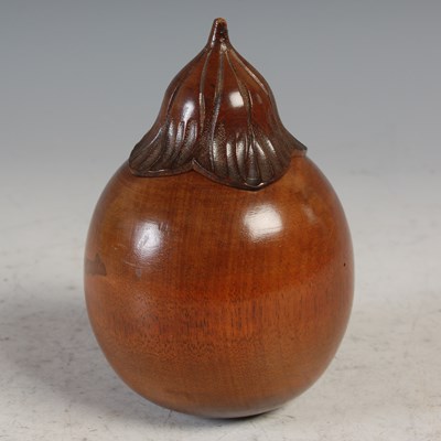 Lot 251 - A carved wood aubergine form tea caddy, with...