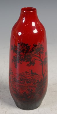 Lot 255 - A Royal Doulton Flambe woodcut vase, printed...