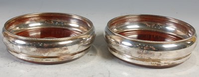 Lot 265 - A pair of Edinburgh silver bottle stands,...