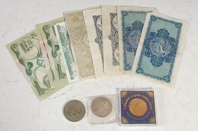 Lot 273 - A collection of assorted coins and banknotes,...