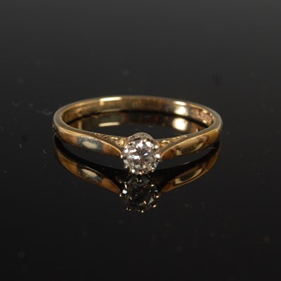 Lot 299 - A 9ct gold and diamond solitaire ring, set...