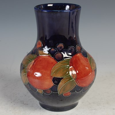 Lot 319 - Pomegranates, a Moorcroft blue ground pottery...