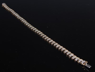 Lot 349 - A 9ct gold and diamond chip bracelet, gross...