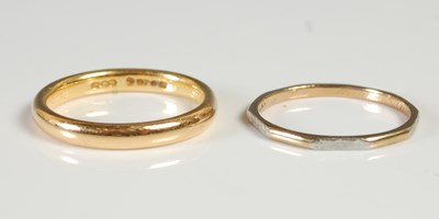 Lot 350 - A 22ct gold wedding ring, 4.6 grams; together...