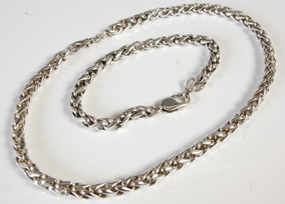 Lot 352 - A silver necklace and matching bracelet, gross...