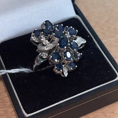 Lot 360A - A white metal, sapphire and diamond cocktail...
