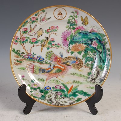 Lot 380 - A Chinese porcelain Famille Rose plate, Qing...