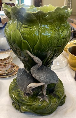 Lot 496 - A late 19th/ early 20th century green glazed...
