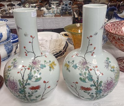 Lot 502 - A pair of Chinese porcelain bottle vases,...