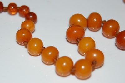 Lot 53 - A vintage butterscotch amber and clear amber...
