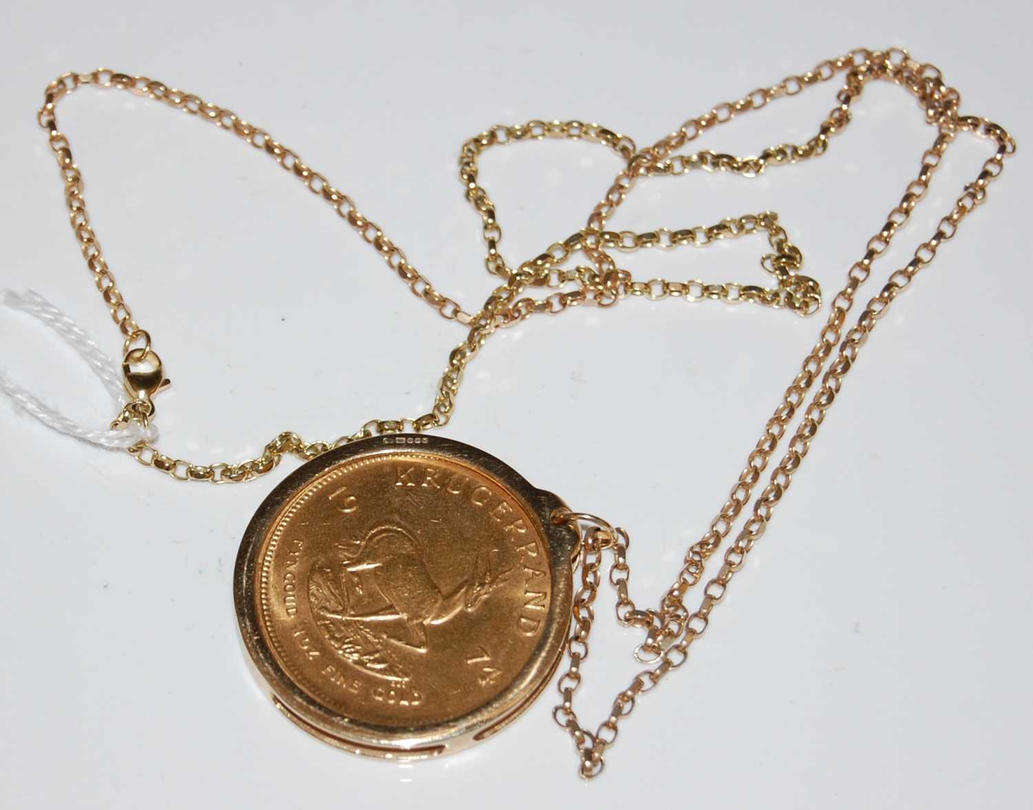 Lot 44 - A 1974 gold Krugerrand in 9ct gold mount...