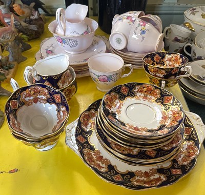 Lot 543 - A Tuscan pink ground floral decorated part tea...