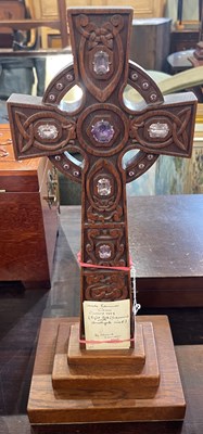 Lot 563 - An early 20th century Arts & Crafts carved oak...